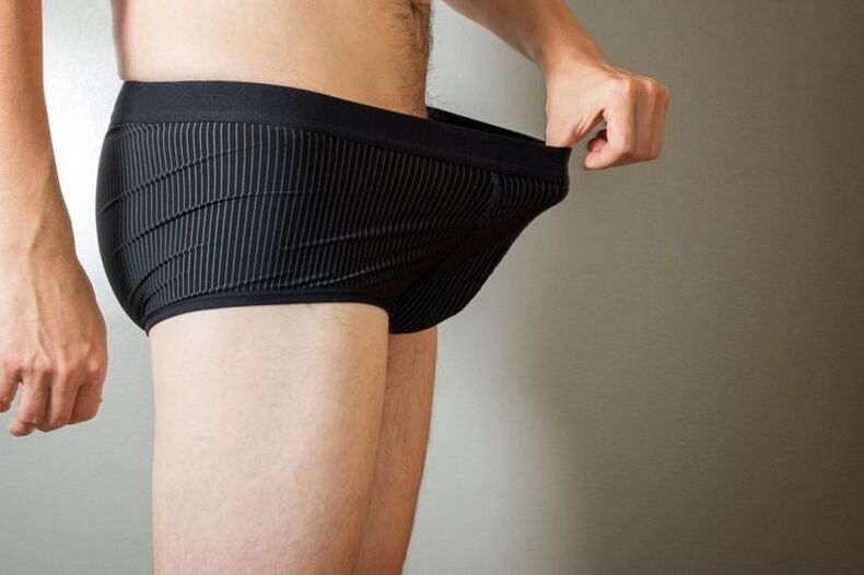 a man takes down his pants and wants to enlarge his penis with soda
